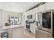 Modern kitchen with white cabinets, stainless steel appliances and island at 3361 Evening Pl, Castle Rock, CO 80109