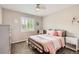 Cozy bedroom features a ceiling fan, neutral colors and lots of natural light at 989 Graland Pl, Highlands Ranch, CO 80126