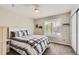 Bedroom features natural light, neutral colors and a double closet at 989 Graland Pl, Highlands Ranch, CO 80126