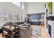 A spacious living room featuring high ceilings, large windows, a cozy sectional sofa, and custom built-ins at 989 Graland Pl, Highlands Ranch, CO 80126
