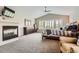 Relaxing primary bedroom featuring a fireplace, large windows, and a comfortable sitting area, a private retreat at 989 Graland Pl, Highlands Ranch, CO 80126