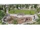 Inviting playground equipped with slides, climbing structures, and shaded picnic areas for families and children at 16488 W 92Nd Pl, Arvada, CO 80007