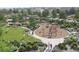 Aerial view of a spacious playground with climbing structures, slides, and a large grassy area for recreation at 16488 W 92Nd Pl, Arvada, CO 80007