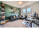 Versatile bedroom with modern desk, comfortable seating, and great natural light at 2840 E 102Nd Pl, Thornton, CO 80229