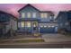 Charming two-story home with a well-maintained lawn and a two-car garage at 2840 E 102Nd Pl, Thornton, CO 80229
