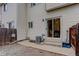 The backyard patio with sliding door access to the home is gravel with a wooden fence at 4504 S Cimmarron Cir # D, Aurora, CO 80015