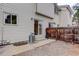 Backyard patio with siding and sliding door access plus gravel and wood privacy fence at 4504 S Cimmarron Cir # D, Aurora, CO 80015