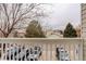 White balcony with a view of the neighborhood and parking at 4504 S Cimmarron Cir # D, Aurora, CO 80015
