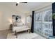 Cozy bedroom with carpet, artwork, ceiling fan, and sliding glass door to deck, offering a peaceful retreat at 4504 S Cimmarron Cir # D, Aurora, CO 80015