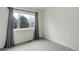 Bedroom featuring carpet, a window with curtains, and lots of natural light at 4504 S Cimmarron Cir # D, Aurora, CO 80015