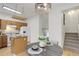 Bright dining area with pendant lighting, eat-in island, and access to the kitchen, perfect for gatherings at 4504 S Cimmarron Cir # D, Aurora, CO 80015