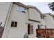 Exterior view of the siding on the rear of the home and sliding door to the backyard at 4504 S Cimmarron Cir # D, Aurora, CO 80015