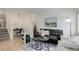 Cozy living room with a comfortable sofa, stylish decor, and a dedicated workspace for added convenience at 4504 S Cimmarron Cir # D, Aurora, CO 80015