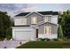 Charming two-story home with a two-car garage, manicured lawn, and inviting curb appeal at 14123 Bunny Hop Ln, Parker, CO 80134