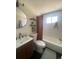 Modern bathroom features a stylish vanity, round mirror, sleek fixtures, and a shower-tub combination at 155 S Pennsylvania St # 209, Denver, CO 80209