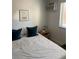 Relaxing bedroom features soft lighting, comfortable bed, and a soothing atmosphere for restful nights at 155 S Pennsylvania St # 209, Denver, CO 80209