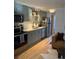 Charming kitchen featuring stainless steel appliances, sleek countertops, and ample cabinet space at 155 S Pennsylvania St # 209, Denver, CO 80209