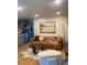 Inviting living room featuring a leather sofa, stylish decor, and an open layout connecting to the kitchen at 155 S Pennsylvania St # 209, Denver, CO 80209