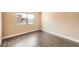 Bright bedroom featuring wood-look floors and a window that offers ample natural light at 303 W Lehow Ave # 22, Englewood, CO 80110