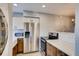 Modern kitchen with white countertops, stainless steel appliances, and hardwood floors at 303 W Lehow Ave # 22, Englewood, CO 80110