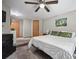 Comfortable bedroom with a ceiling fan and a view of the outdoors at 1217 Lincoln St, Longmont, CO 80501