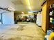 Spacious garage featuring ample storage cabinets, skylights, and room for multiple vehicles or a workshop at 1217 Lincoln St, Longmont, CO 80501