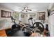 Home gym featuring exercise equipment, a ceiling fan, and windows offering natural light at 1217 Lincoln St, Longmont, CO 80501