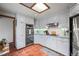 Bright kitchen with updated cabinets, stainless steel appliances, and a skylight providing ample natural light at 1217 Lincoln St, Longmont, CO 80501