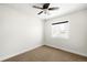 Bright bedroom featuring neutral walls, carpet, and a window providing ample natural light at 3402 N Clayton St, Denver, CO 80205