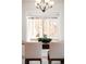 Dining room featuring a modern table, chairs, and modern lighting fixture at 3402 N Clayton St, Denver, CO 80205