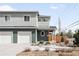 Charming two-story home with a two-car garage and beautifully landscaped front yard at 3402 N Clayton St, Denver, CO 80205