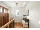 Bright foyer with hardwood floors, stylish console table, and natural light through an octagon window at 3402 N Clayton St, Denver, CO 80205