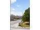 Charming neighborhood street view with mature trees and distant mountain views at 3402 N Clayton St, Denver, CO 80205