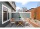 Outdoor patio space with modern dining table and chairs, perfect for entertaining at 3402 N Clayton St, Denver, CO 80205