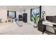 Finished basement area with neutral carpet, play area, and home office at 12 Apache Plume St, Brighton, CO 80601