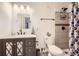 Contemporary bathroom featuring white vanity and tiled standing shower at 12 Apache Plume St, Brighton, CO 80601