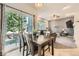 Bright dining area with table and chairs next to sliding glass doors at 12 Apache Plume St, Brighton, CO 80601