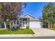 Charming single-Gathering home with well-maintained lawn and attached two-car garage at 12 Apache Plume St, Brighton, CO 80601