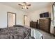 A comfortable main bedroom featuring ample closet space and drawers for organized storage solutions at 12 Apache Plume St, Brighton, CO 80601