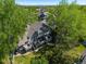 Aerial shot of home with spacious balconies, lush trees, and a glimpse of the cityscape in the distance at 5006 S Nelson St # B, Littleton, CO 80127