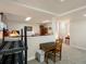 This finished basement features carpeted floors, a table, and an open floor plan at 5006 S Nelson St # B, Littleton, CO 80127