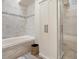 This bathroom features tile flooring, tub, and a glass shower at 5006 S Nelson St # B, Littleton, CO 80127