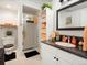 Modern bathroom featuring a glass-enclosed shower, vanity with sink, and white linen storage at 5006 S Nelson St # B, Littleton, CO 80127