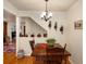 Comfortable dining area with a classic wooden table and quaint decor, illuminated by a stylish chandelier at 5006 S Nelson St # B, Littleton, CO 80127