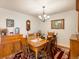 Dining room with hardwood floors, traditional furnishings, and chandelier lighting at 5006 S Nelson St # B, Littleton, CO 80127