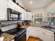 Modern kitchen with granite countertops, stainless steel appliances, and a cozy breakfast nook at 5006 S Nelson St # B, Littleton, CO 80127