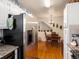 Charming eat-in kitchen with stainless steel appliances and adjacent hardwood dining area at 5006 S Nelson St # B, Littleton, CO 80127