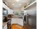 Bright kitchen featuring granite countertops, stainless steel appliances, and ample cabinet space at 5006 S Nelson St # B, Littleton, CO 80127