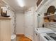 Well-organized laundry area with modern appliances, ample storage, and stylish decor at 5006 S Nelson St # B, Littleton, CO 80127