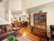 Open concept living and dining areas, with hardwood floors and classic furnishings at 5006 S Nelson St # B, Littleton, CO 80127